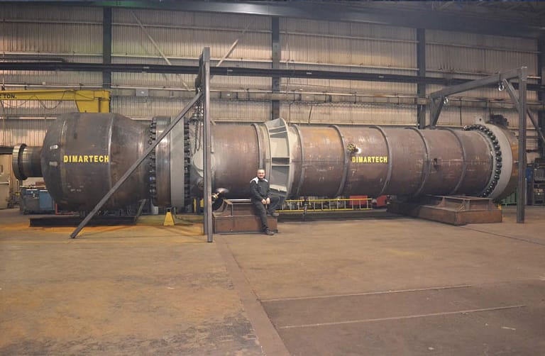 Reactor per ASME Sect.VIII Div.1, SA-516.70 3’’ (75mm) plate, 1200 psi MAWP, 8ft dia. x 50ft long, internal cladding in SS316L, internal tube bundle SS316L, 14’’ thick custom made weld neck flanges, all bolting 3.75’’ dia., total 260,000 lbs, (Alberta)